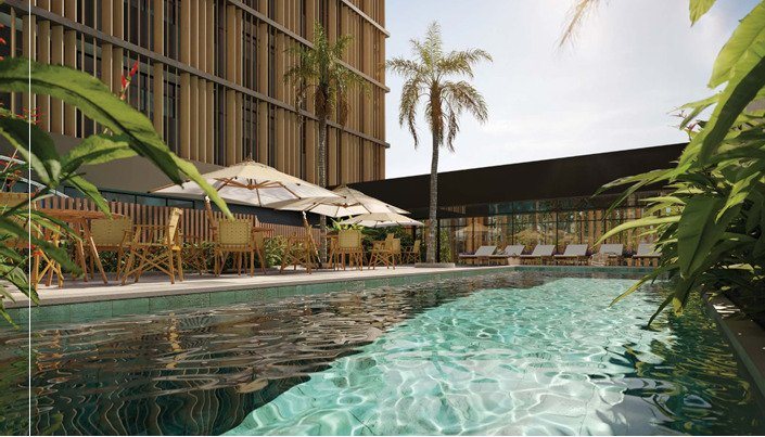 Piscina externa com solarium e palmeiras do Autór Jardins, nos Jardins, em São Paulo