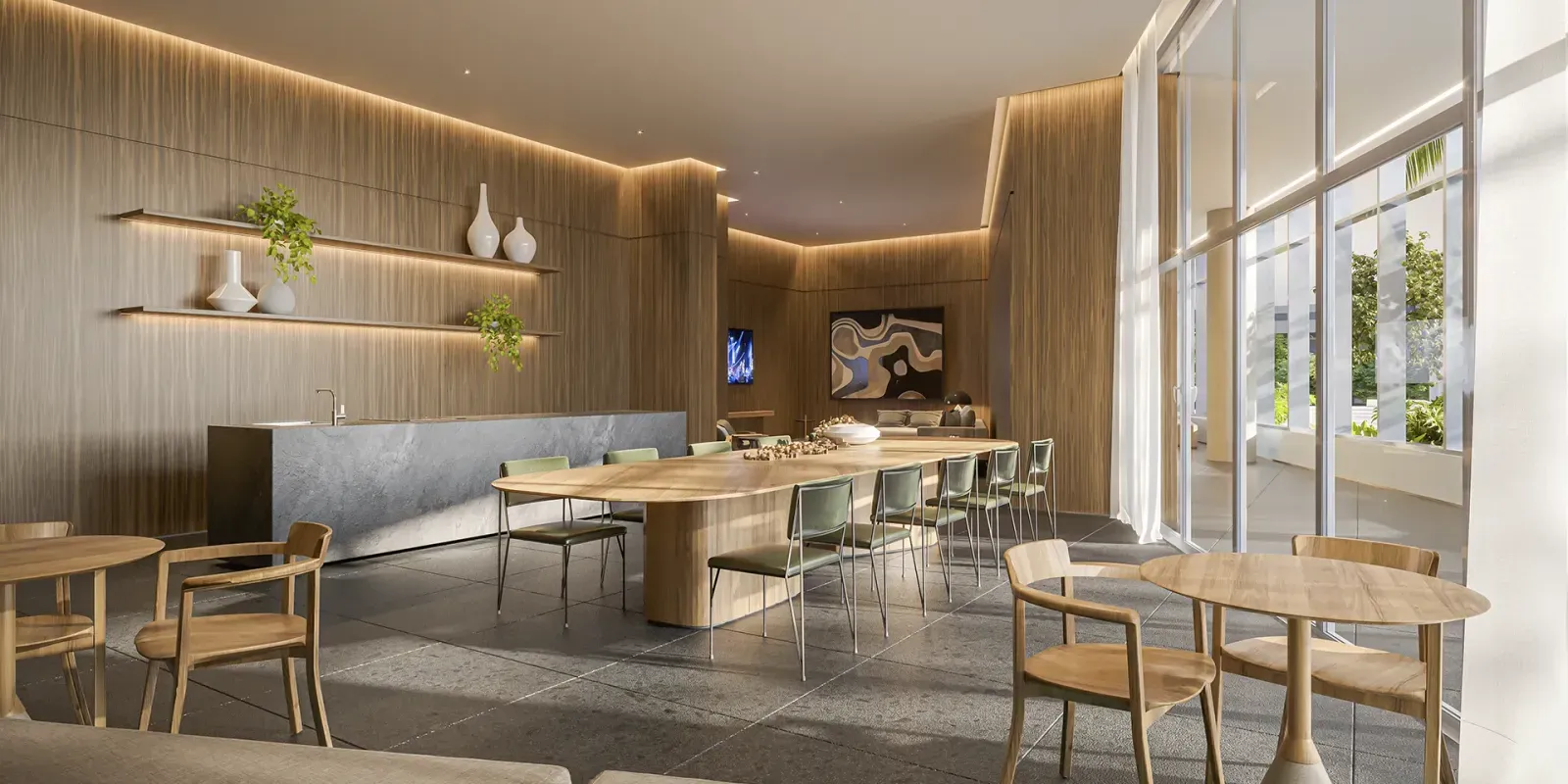 Salão de festas gourmet do VISAR Jardim Europa, com mesa comunitária e cozinha integrada