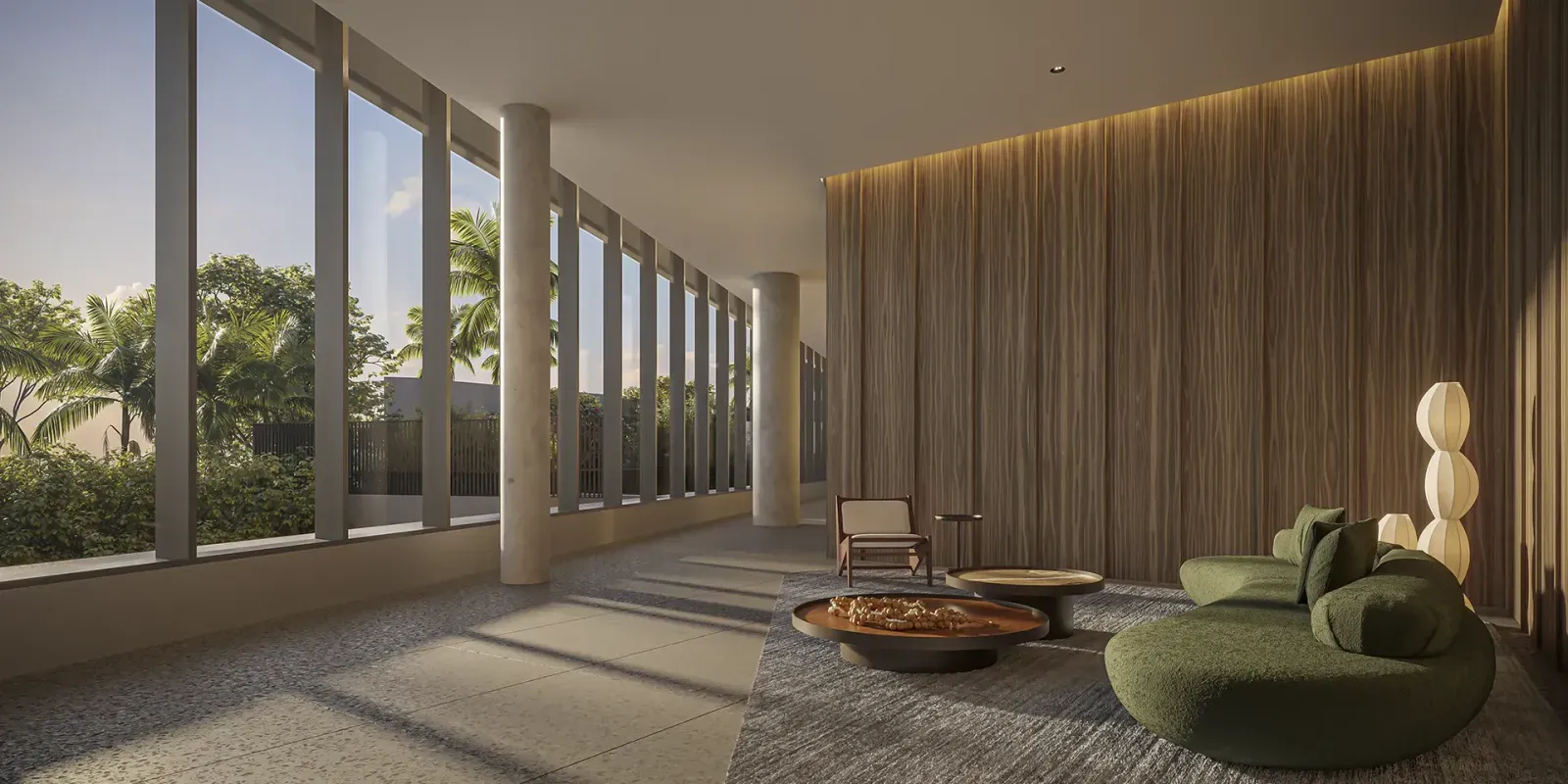 Lounge de convivência do VISAR Jardim Europa, com poltronas e iluminação ambiente