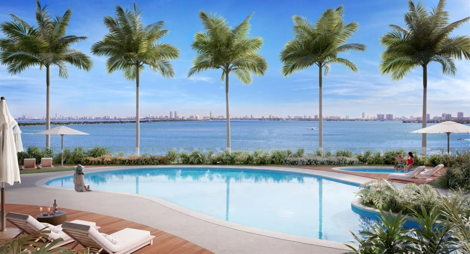 Waterfront pool deck with palm trees and bay views at Aria Reserve Miami