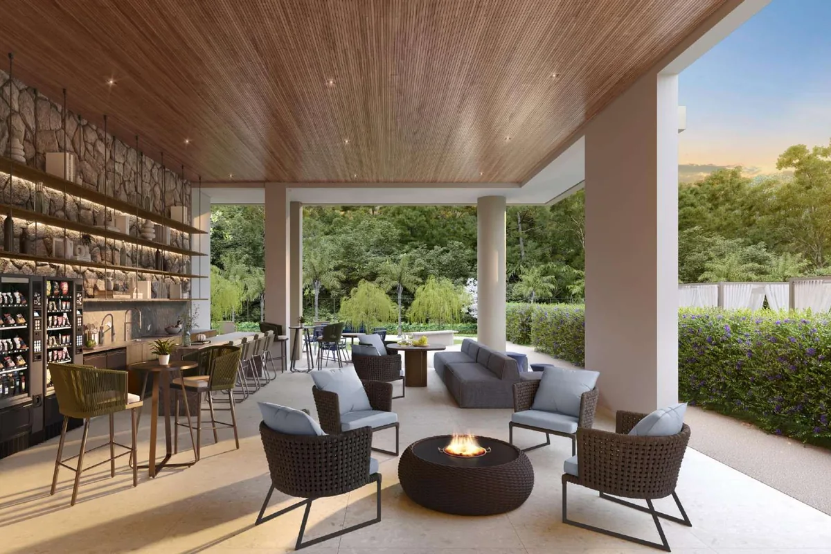 Bar da piscina do Kaá Home Boutique, com fire place e estar coberto